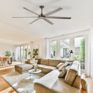 Four Seasons Living Large 8-blade gunmetal grey smart dc ceiling fan in a spacious open-plan living room